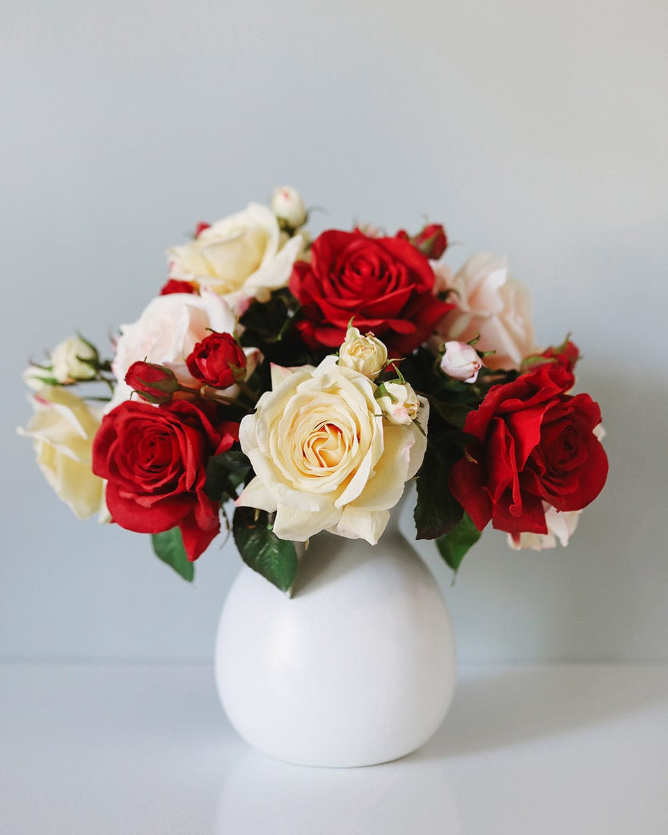 Red and Yellow Roses Flower Arranged in Vase